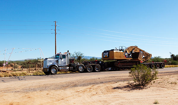 Truck with Cat 336E excavator on lowboy trailer  Arizona